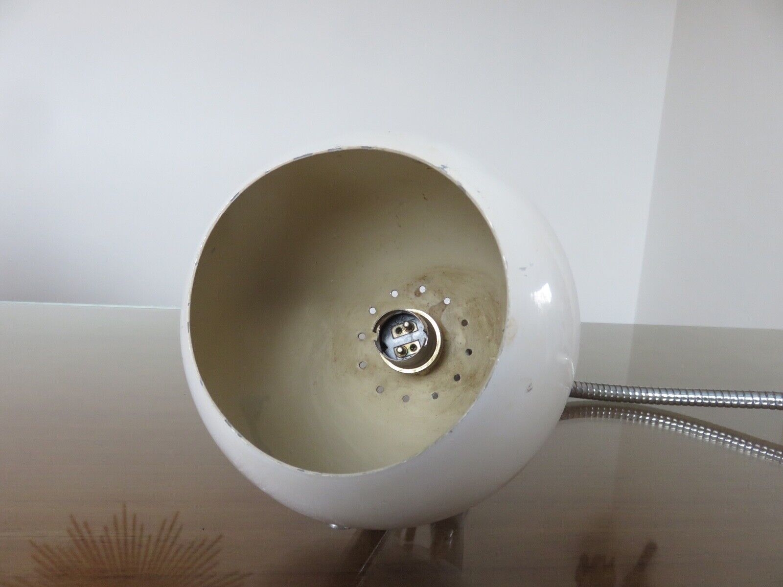 Eye ball lamp stapled on a chrome hose 70s