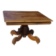 Old walnut table with a central leg.