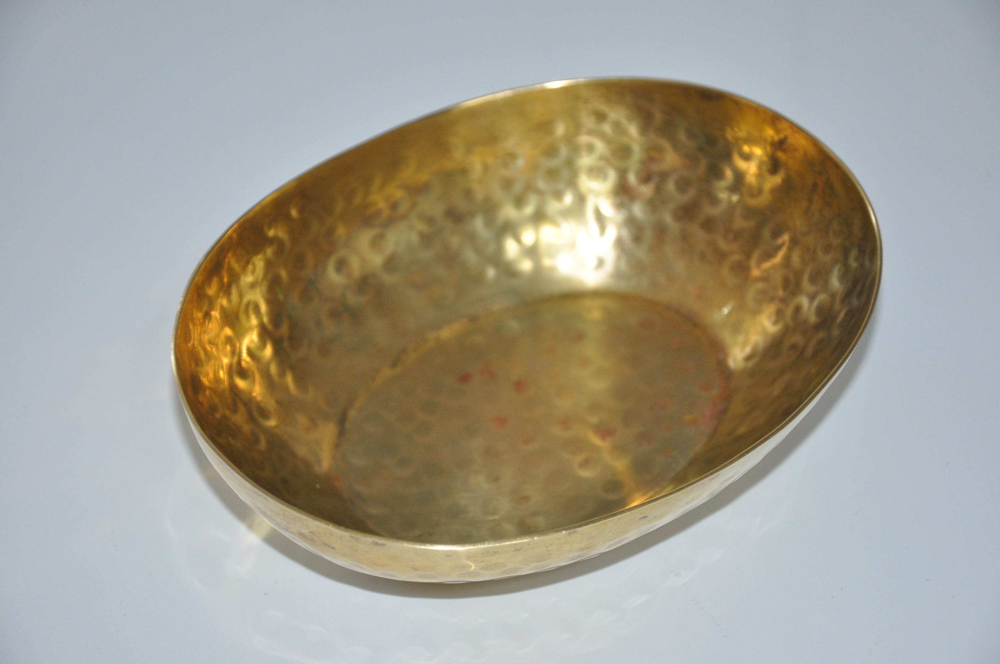 Empty hammered brass pocket