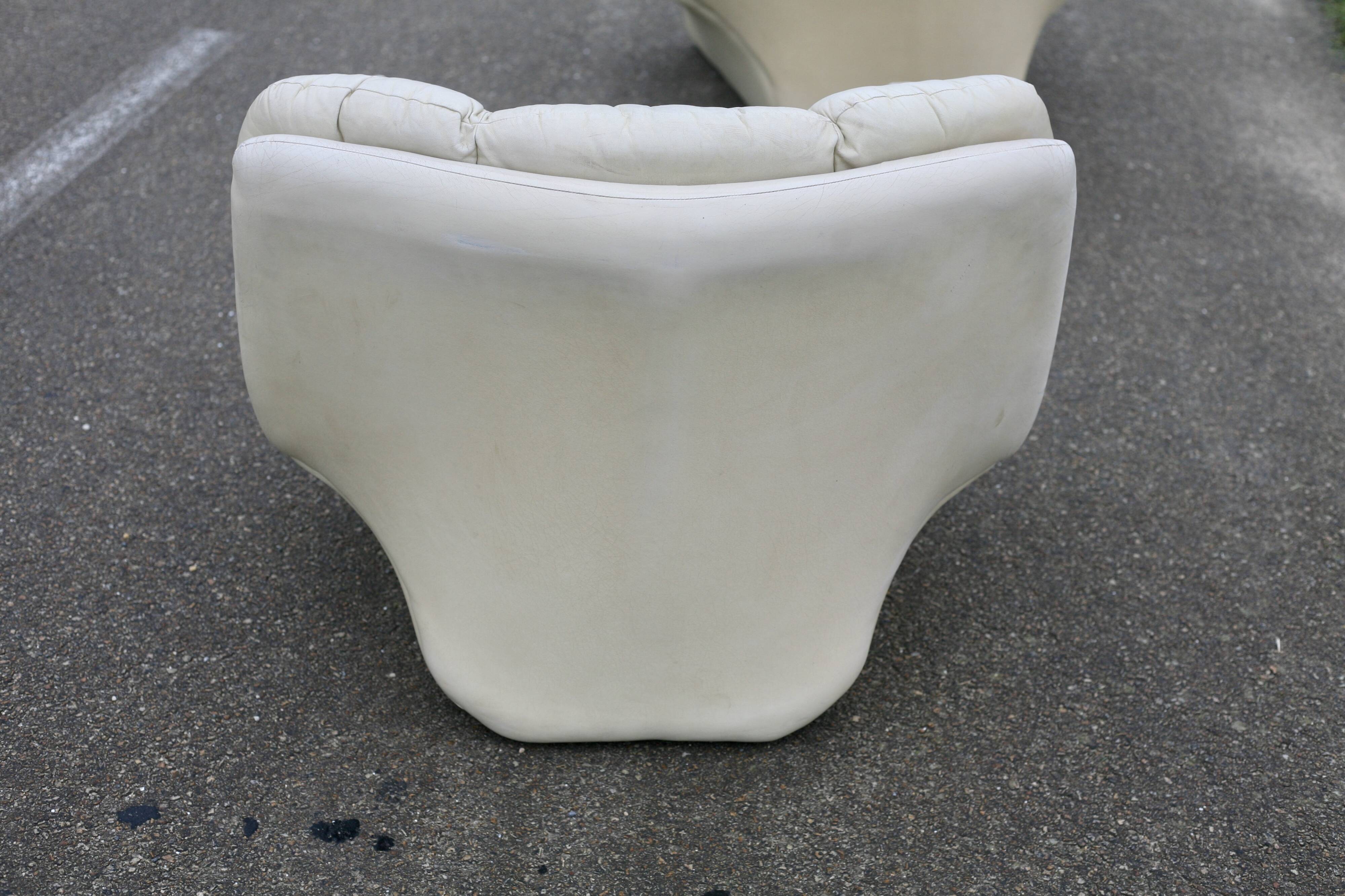 Pair of leather “space age” armchairs. Cream colour". Circa 1970.