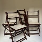 Set de quatre chaises pliantes en bois et cannage