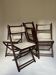 Set of four folding chairs in wood and cane.