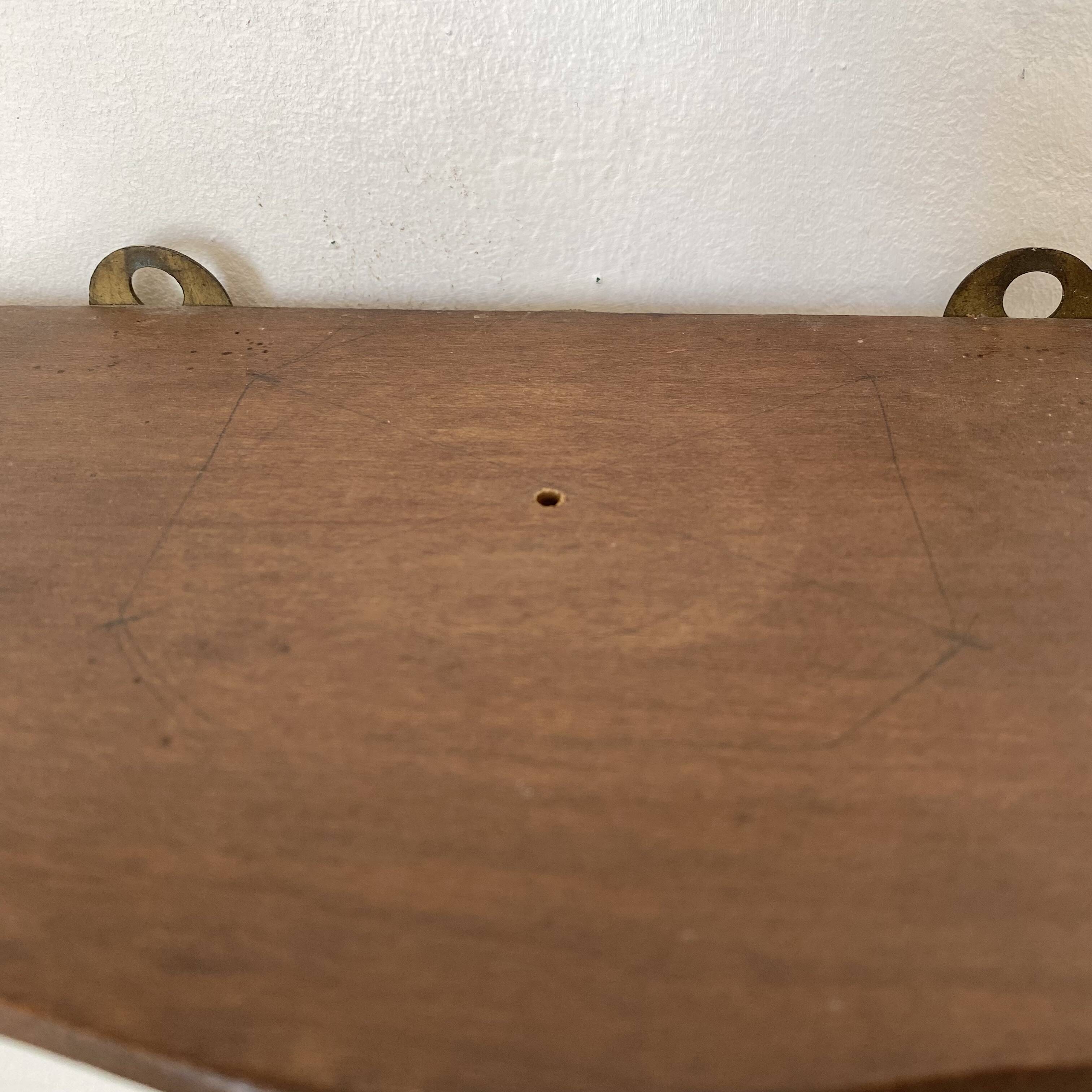 baroque shelf in wood and bronze ribbon