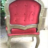 Louis XV style armchair in molded and carved wood with gray and gold patina