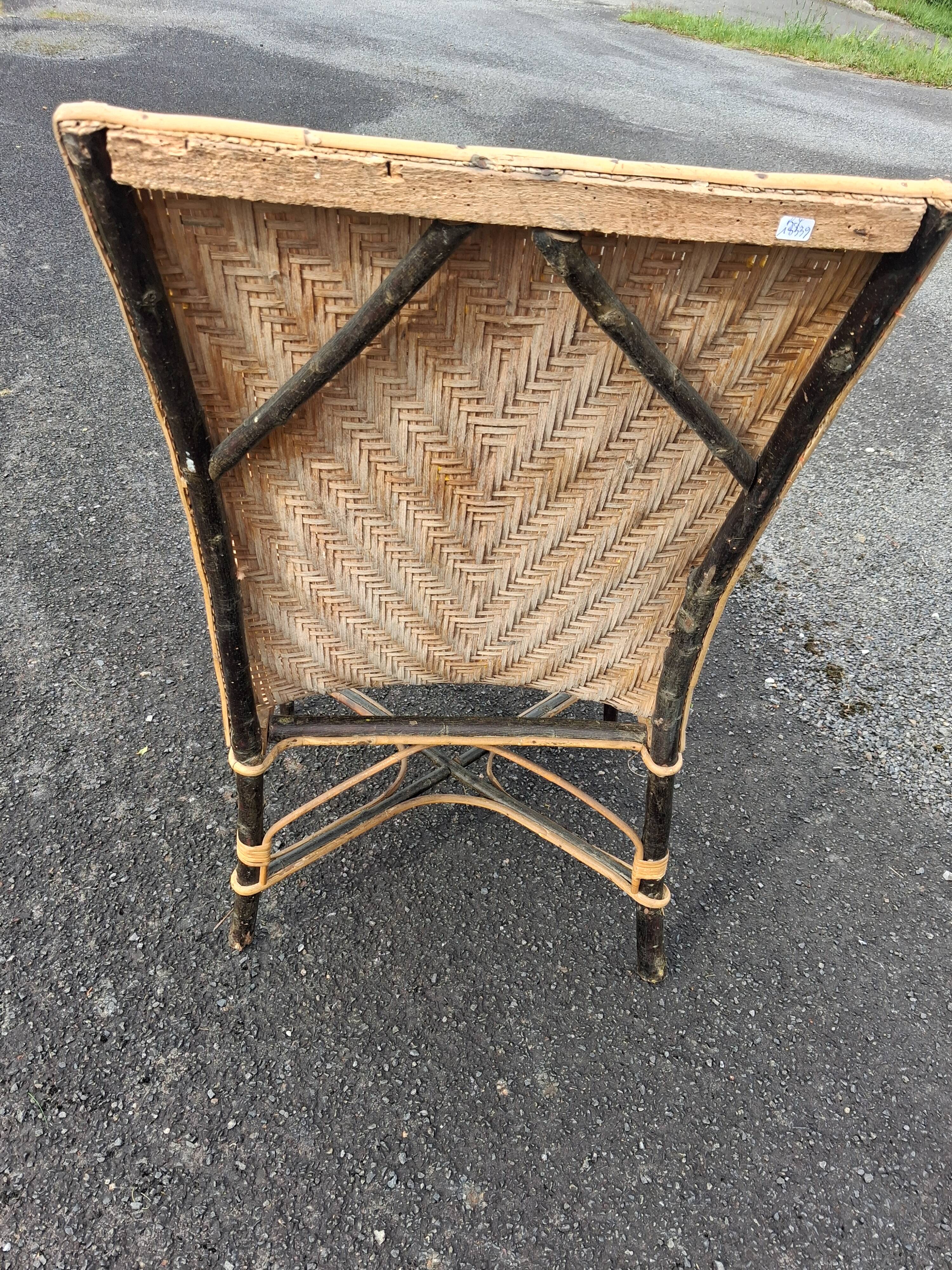 Antique high-back rattan armchair