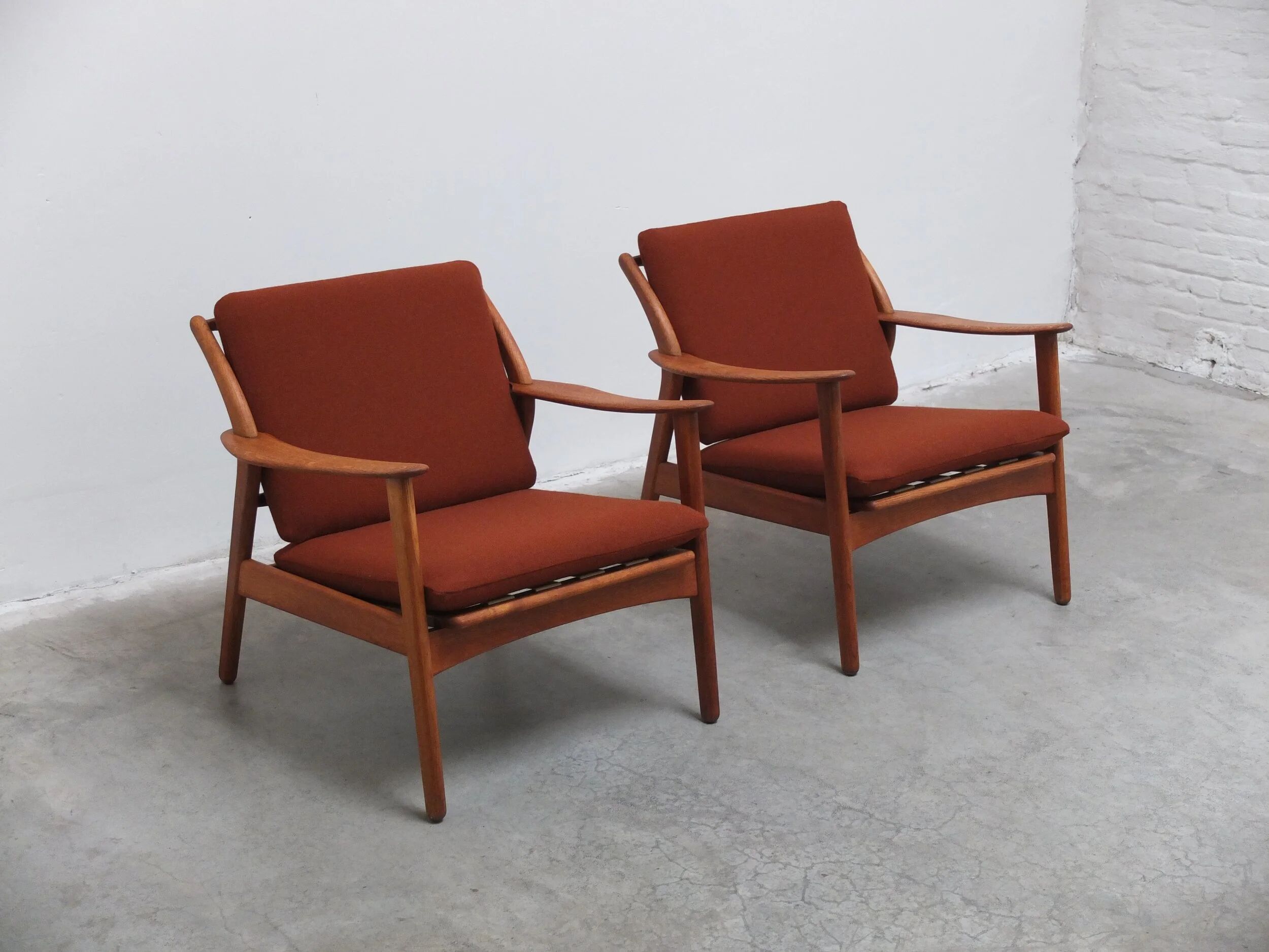 Danish pair of easy chairs in oak by Niels Koefoed, 1960s