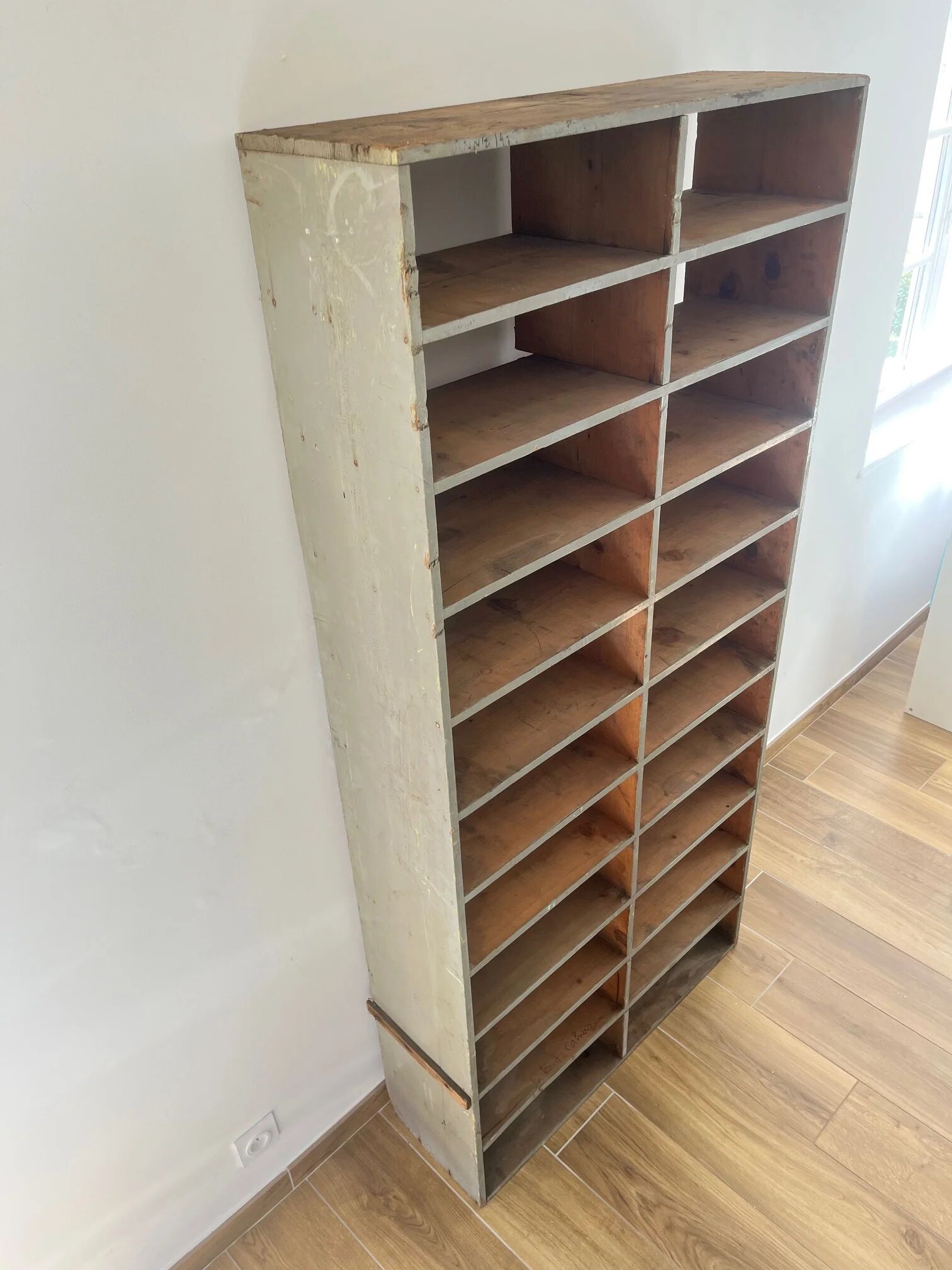 Large antique workshop cabinet with patinated wooden compartments, 20th century.
