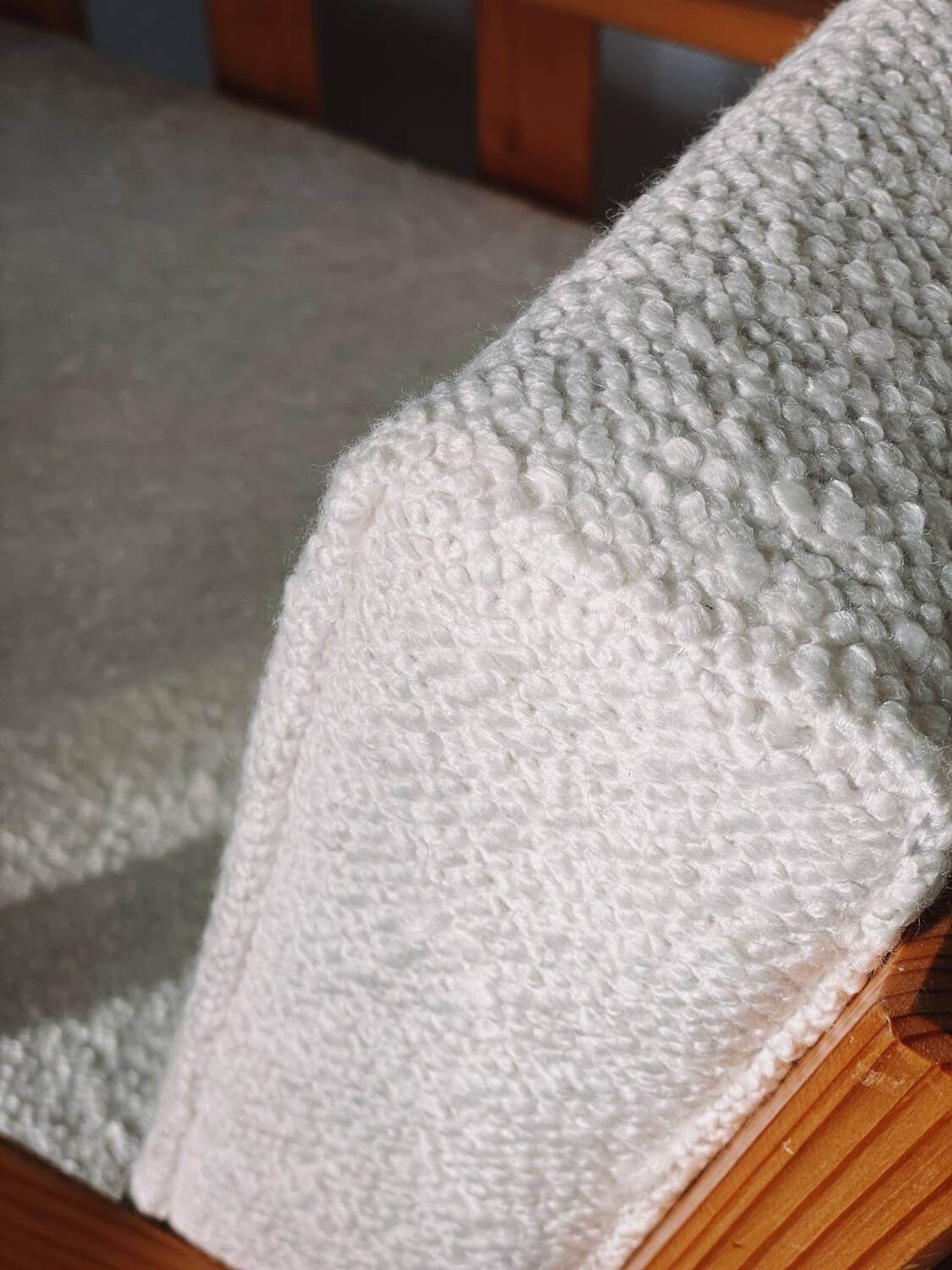 Brutalist armchair in wood and bouclé fabric