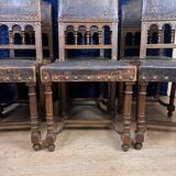 Set of 8 Renaissance style chairs in walnut and embossed leather