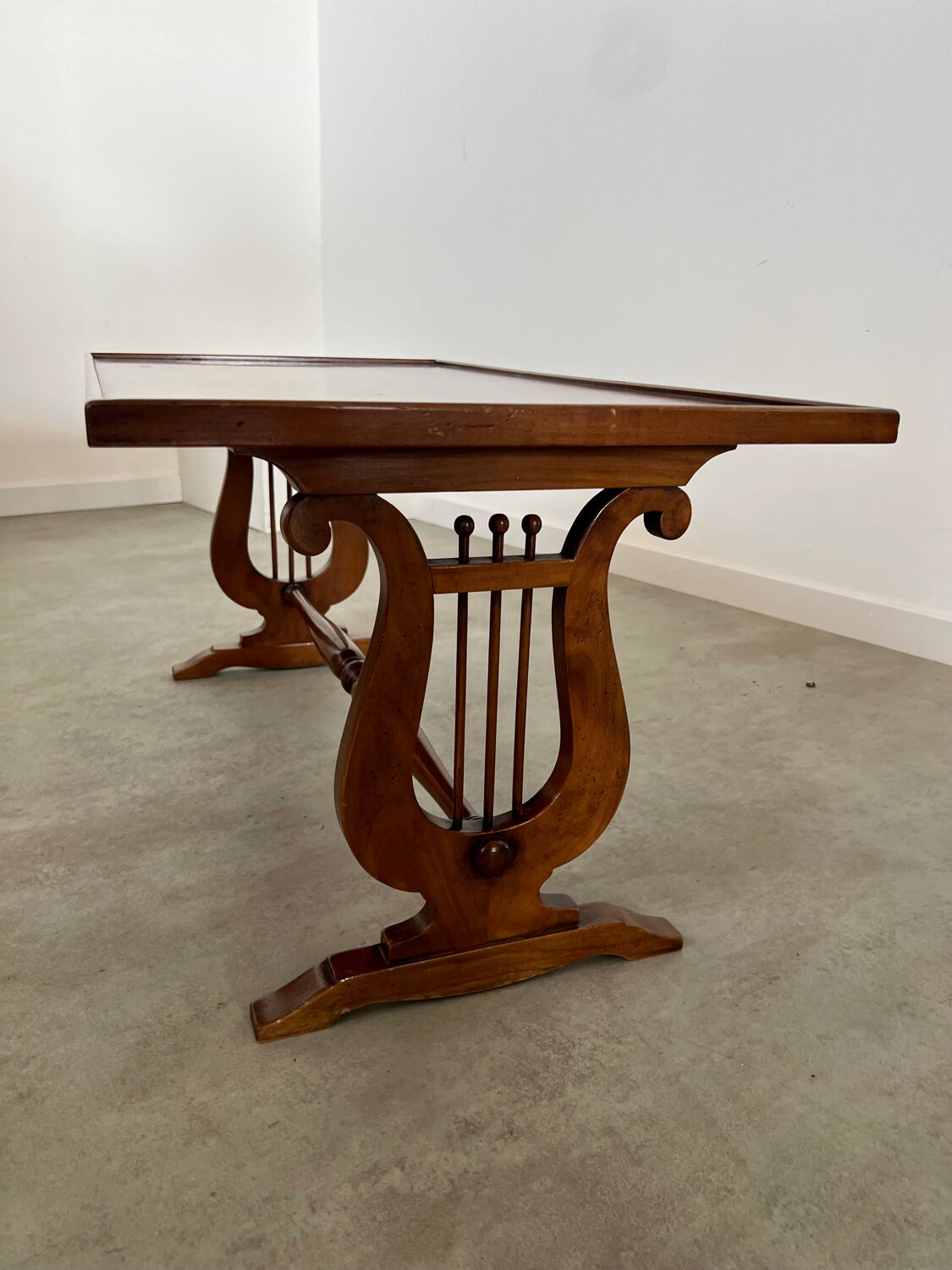Old rectangular wood coffee table with lyre side posts