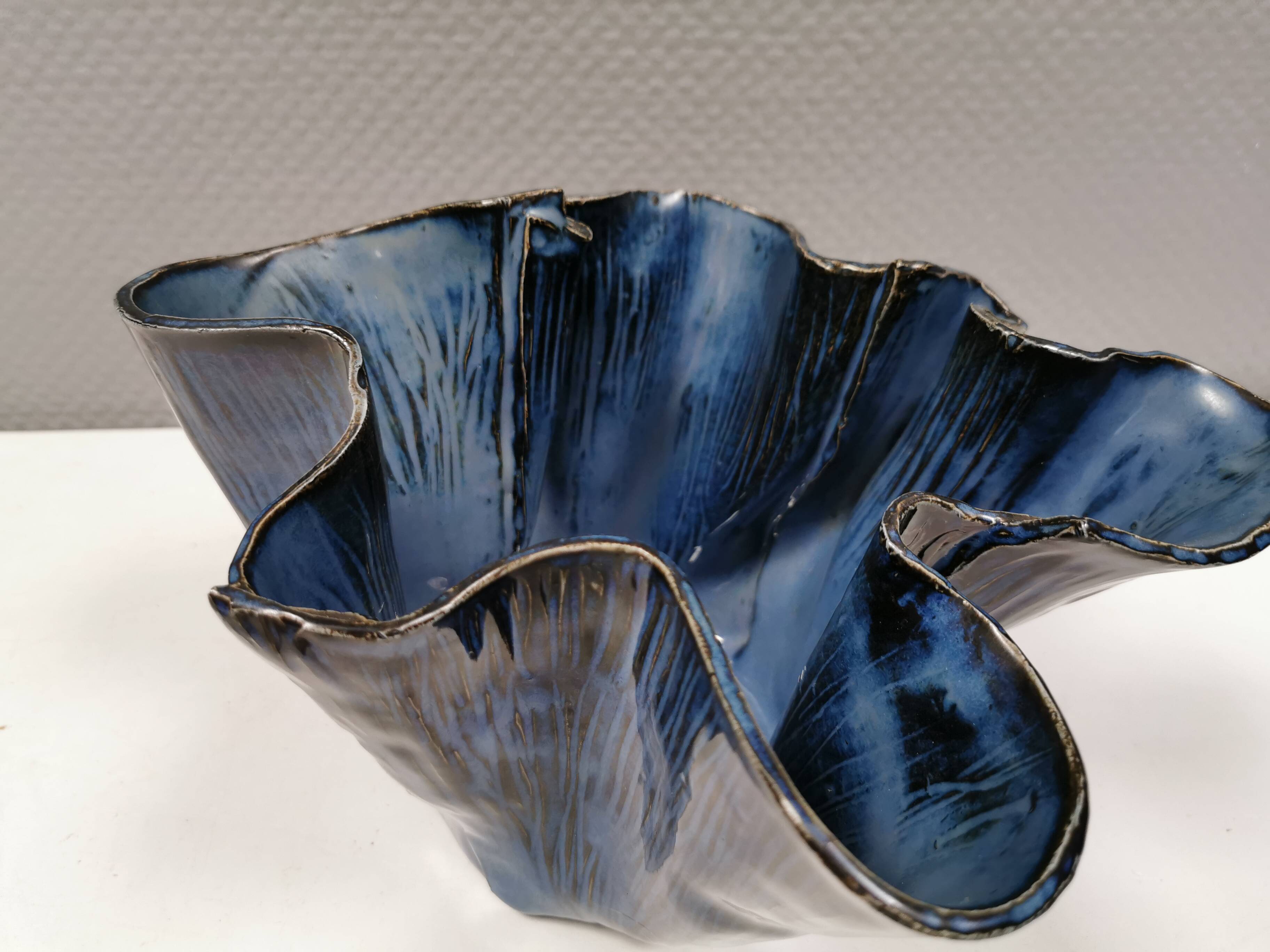 Very special vase in “folded” bluish glazed clay.