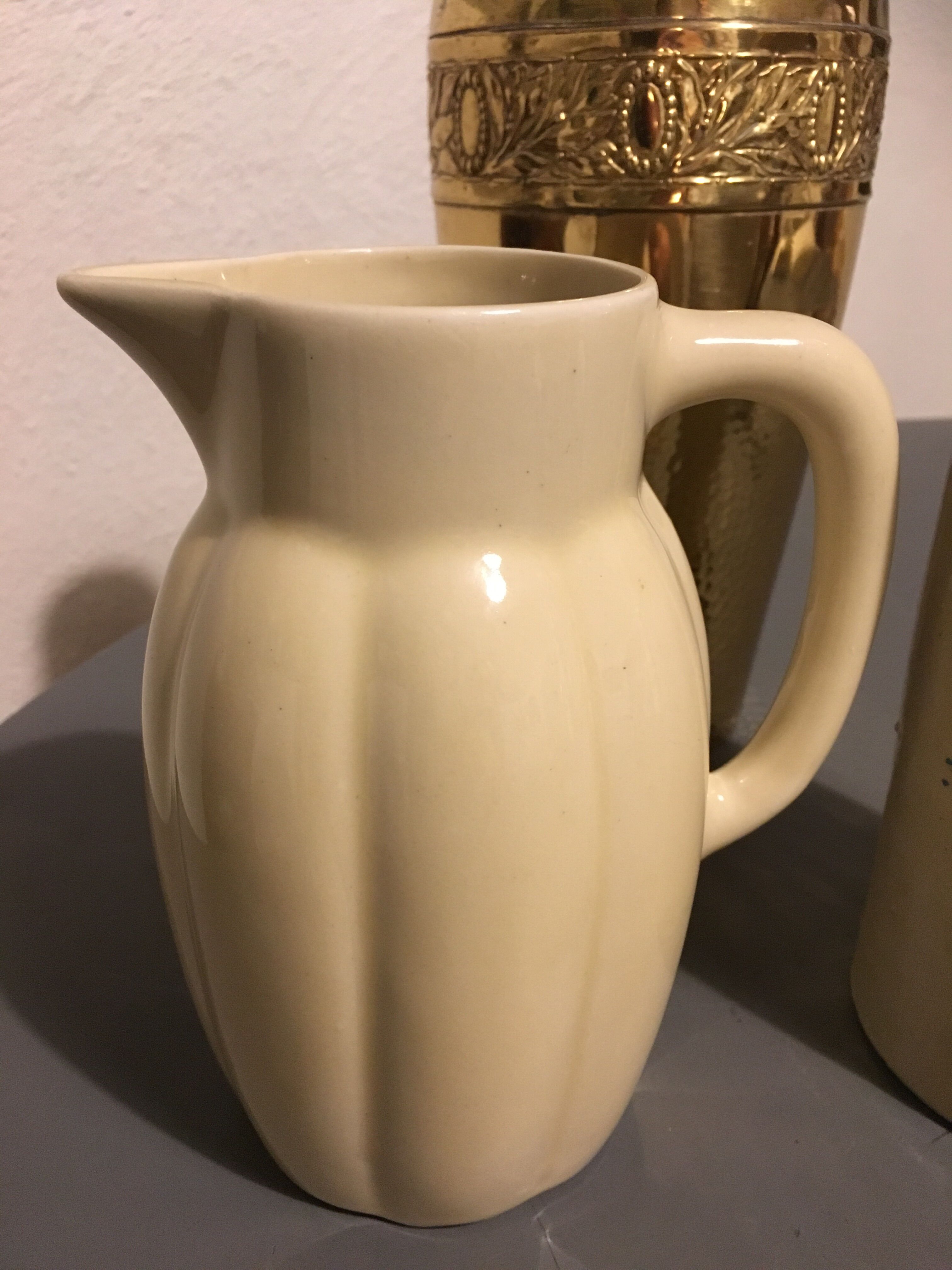 Cream color earthenware pitcher