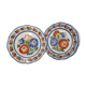 Pair of Henriot Quimper plates decorated with flower, 24 cm