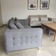 Three-seater grey mottled fabric sofa