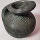 Vintage native american jug pot with geometric patterns in green / gray tones