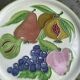 Decorative plate to hang, fruit model, in enamelled ceramic, Les Fruits, signed Luciano