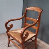 Rustic straw armchair with butts