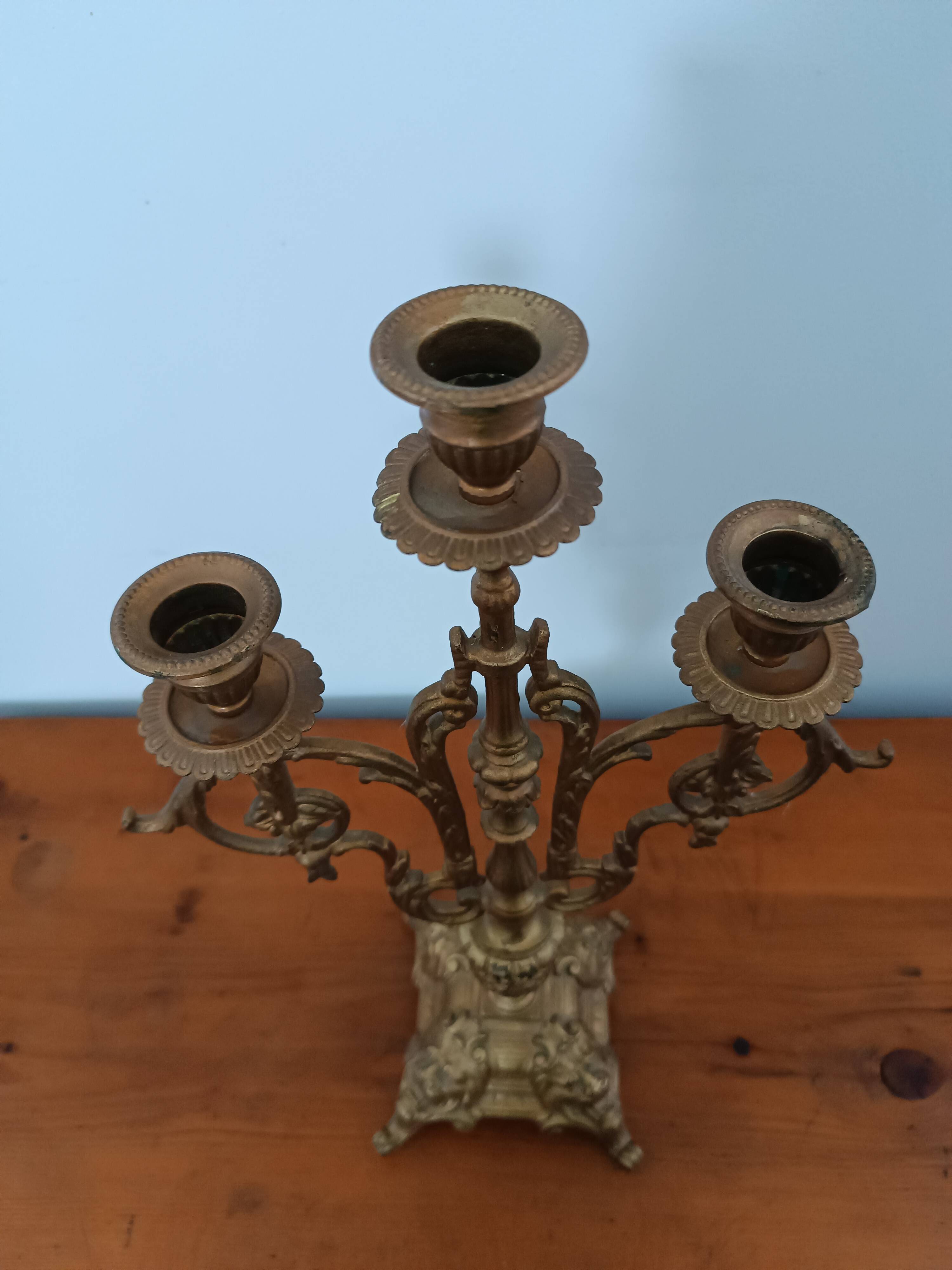Bronze candlestick with lion head decoration