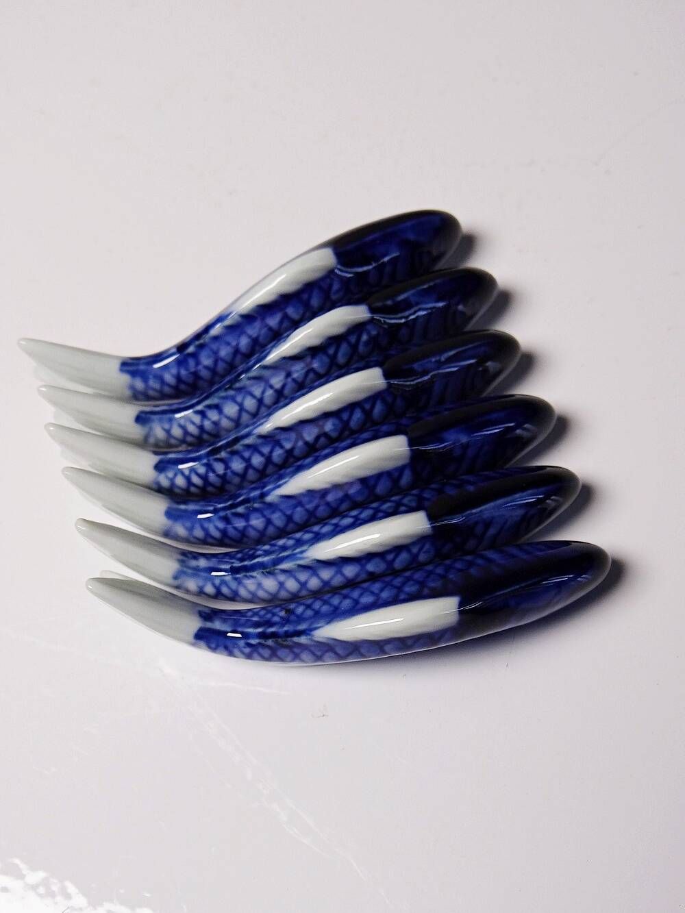 6 porcelain koi carp chopstick/knife rests, China, 1960s-1980s