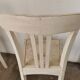 Set of 6 mismatched white chairs
