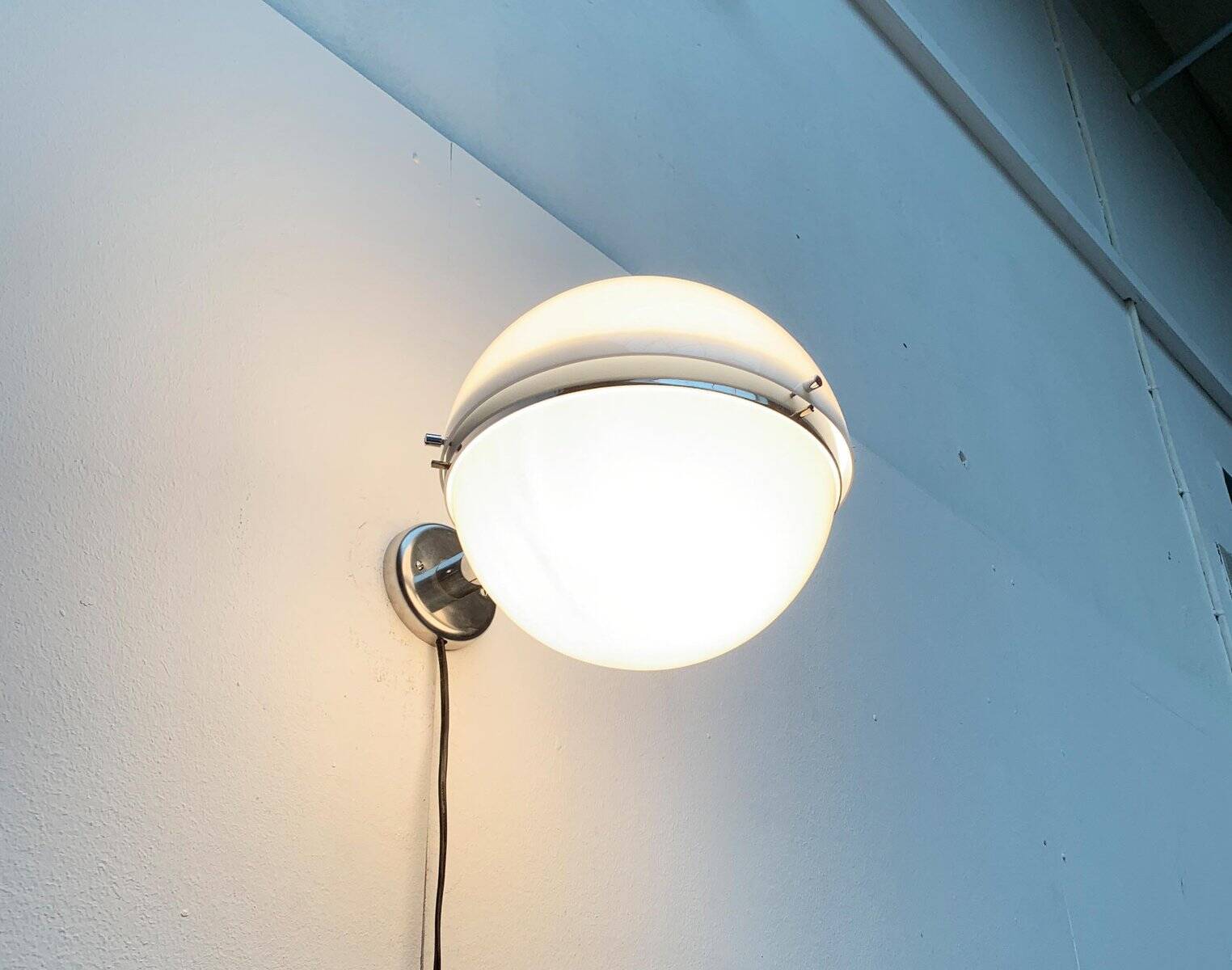Mid-century Italian space age spherical wall light by Guzzini.