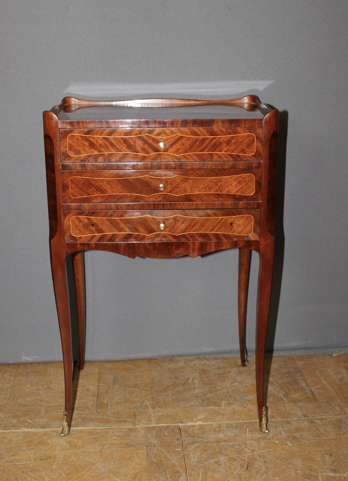Pair of Louis XV style bedside tables in marquetry, 20th century.