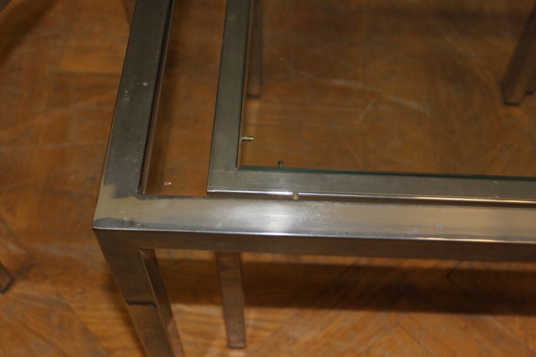 Coffee table and its steel and glass wiggles around 1970