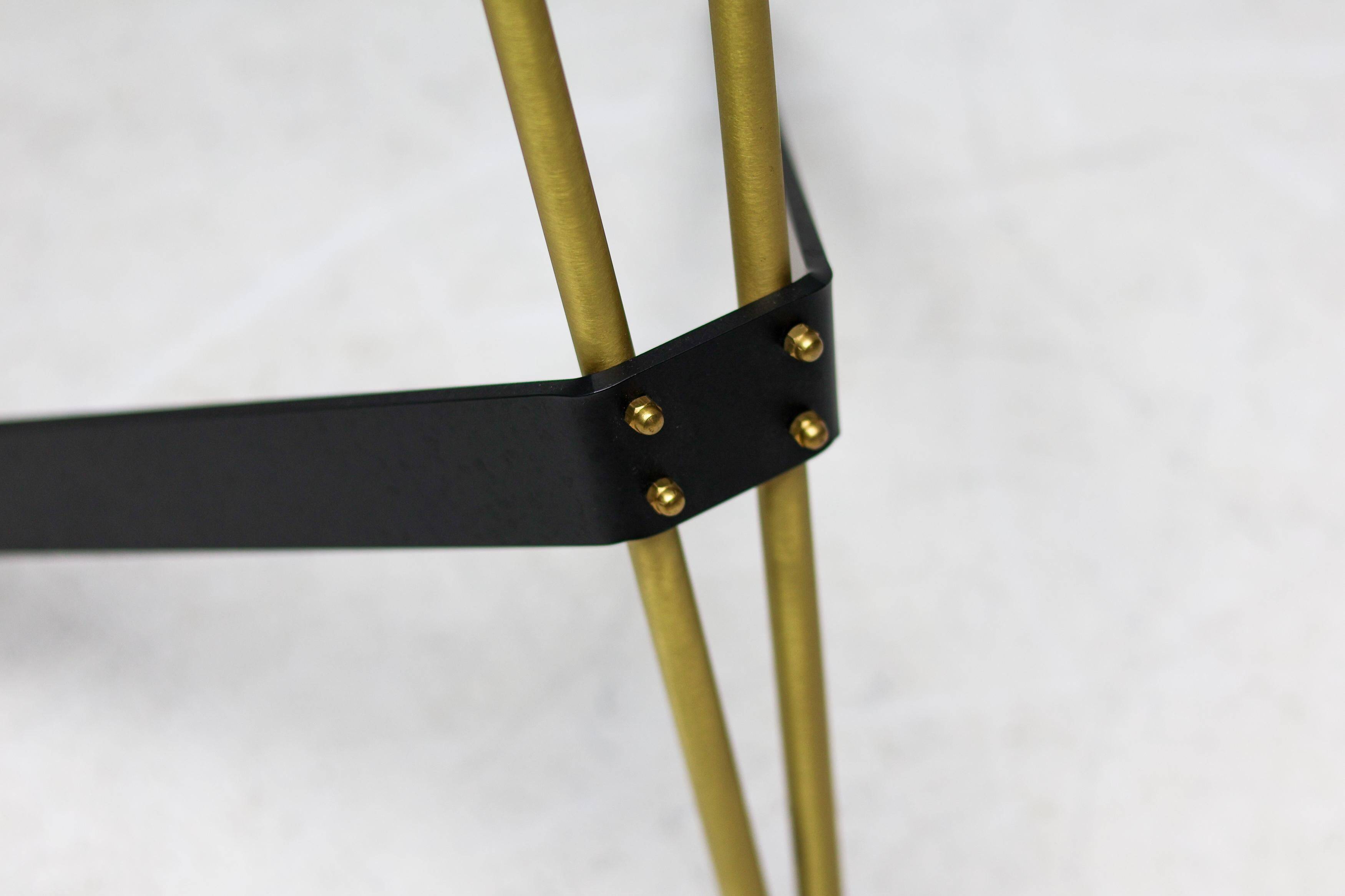Kite floor lamp by Pierre Guariche, brass and steel, mid-20th century.