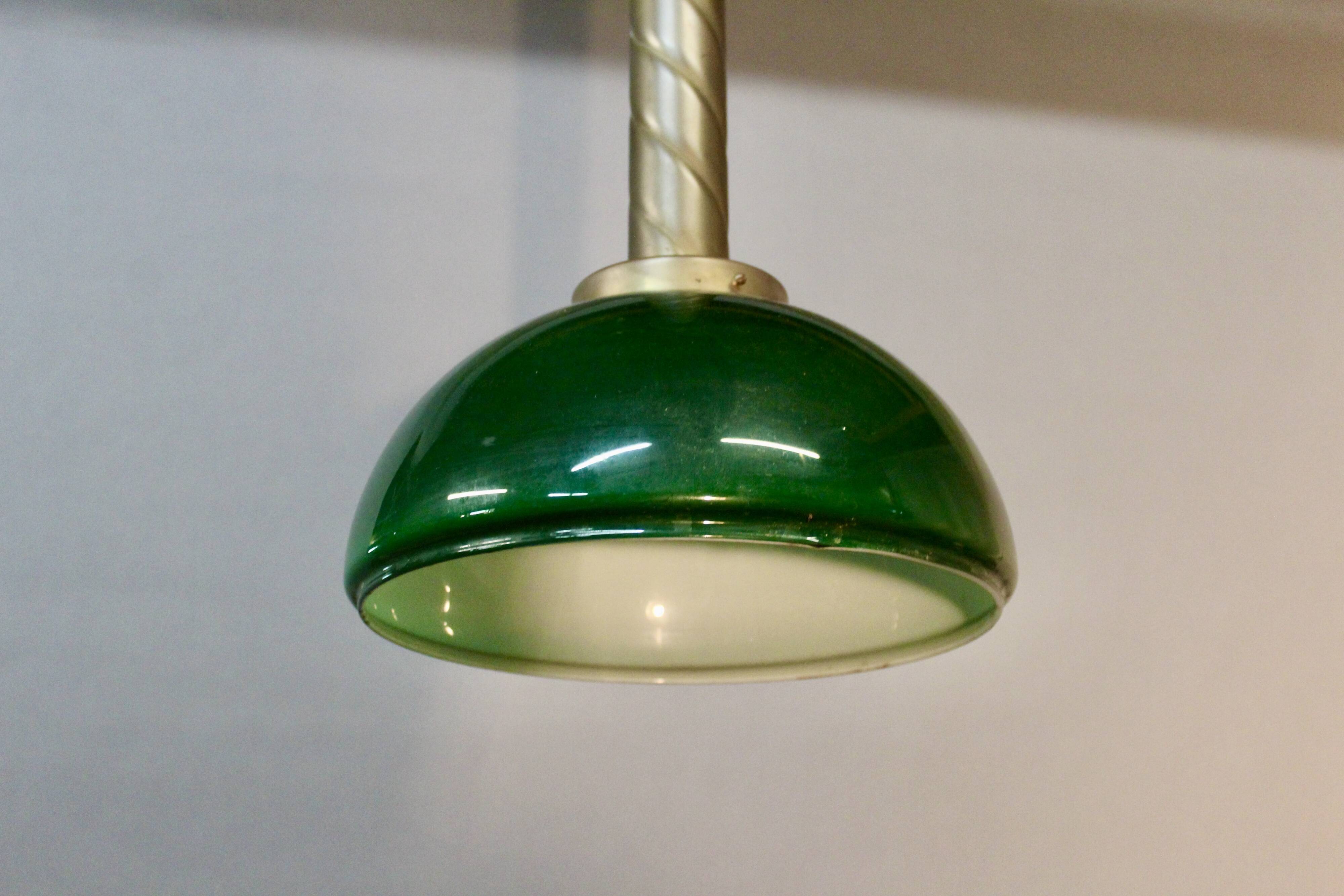 Chandelier with brass body and green opaline