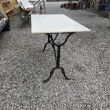 Bistro table with marble top and cast iron base