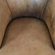 Vintage sheepskin club armchair with character and a beautiful patina