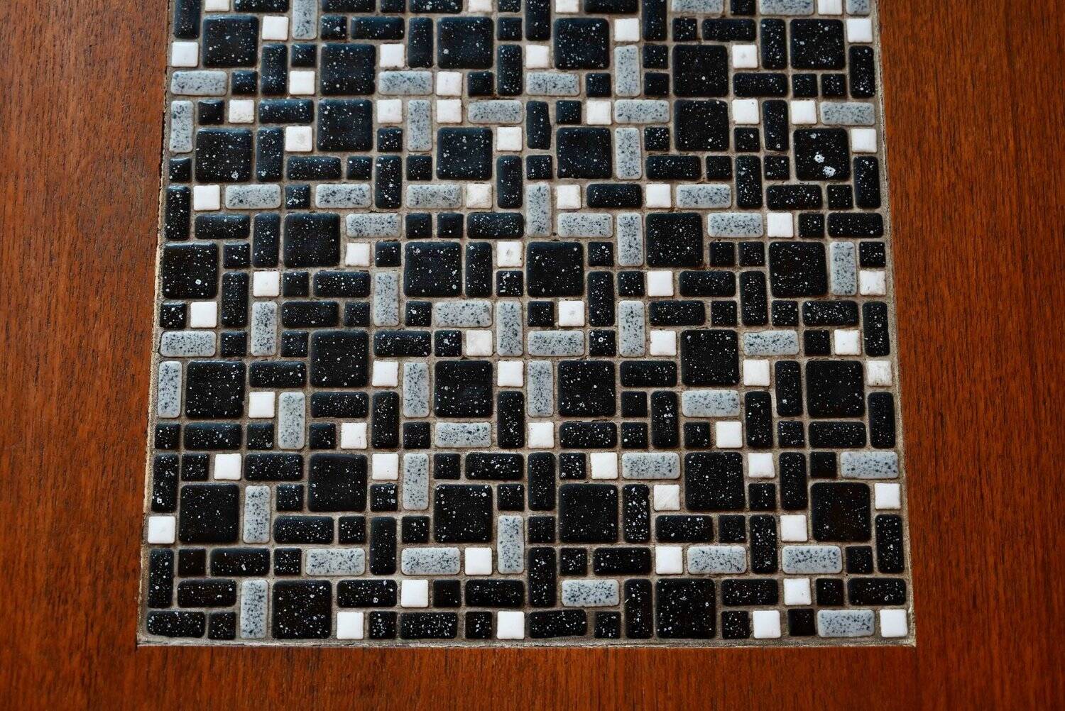1970s coffee table with a tapered teak base and ceramic mosaic.