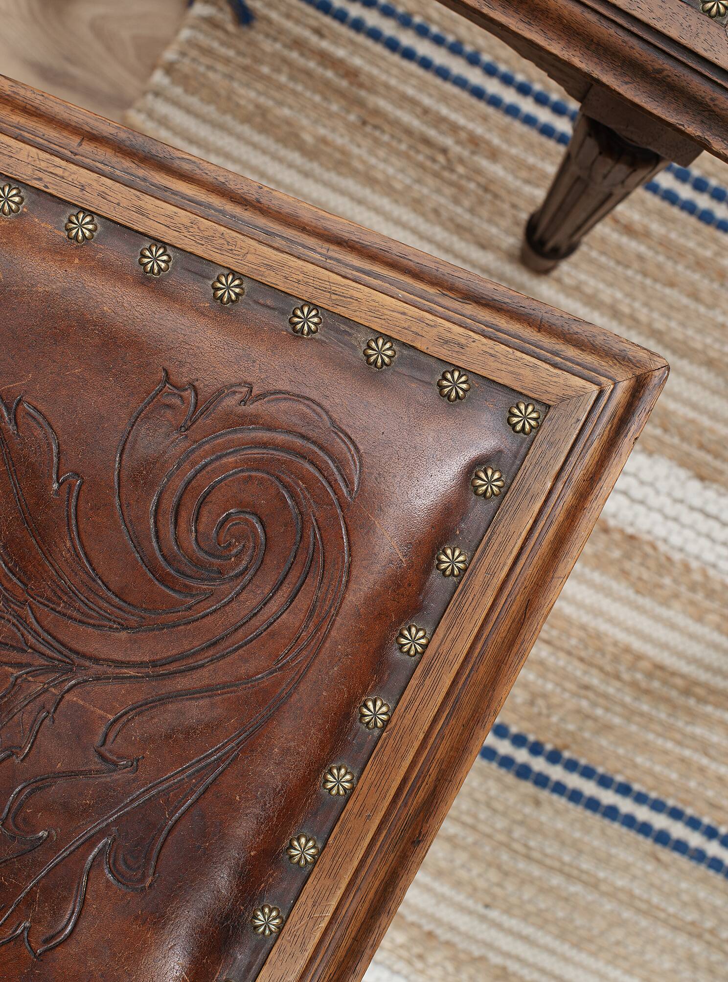 Set of 4 Louis XVI style chairs in carved wood and embossed leather.