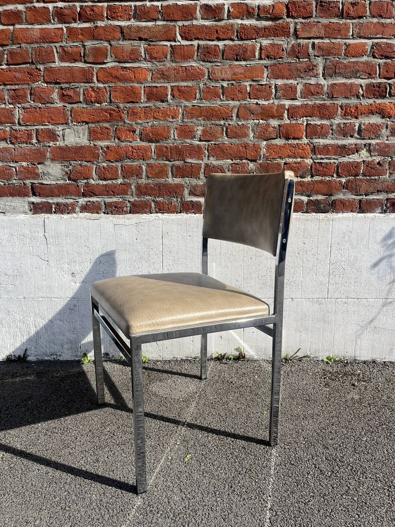 Set of 4 vintage chairs in chrome and faux leather.