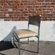 Set of 4 vintage chairs in chrome and faux leather.
