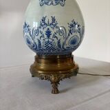 19th-century blue grand feu faience lamp, tripod bronze, fringed lampshade.