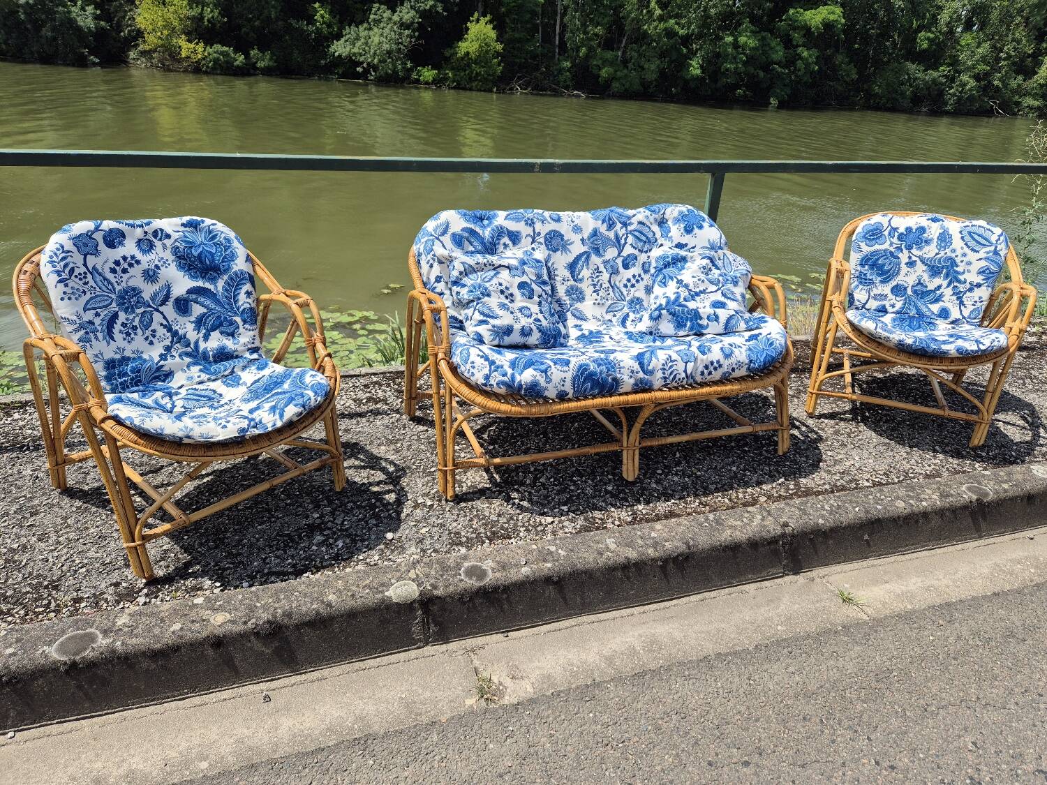 Rattan lounge with two armchairs and a vintage 1950s bench.