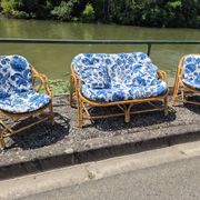 Rattan lounge with two armchairs and a vintage 1950s bench.