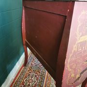French XIX jumping chest of drawers in Chinese lacquer ox and golden blood