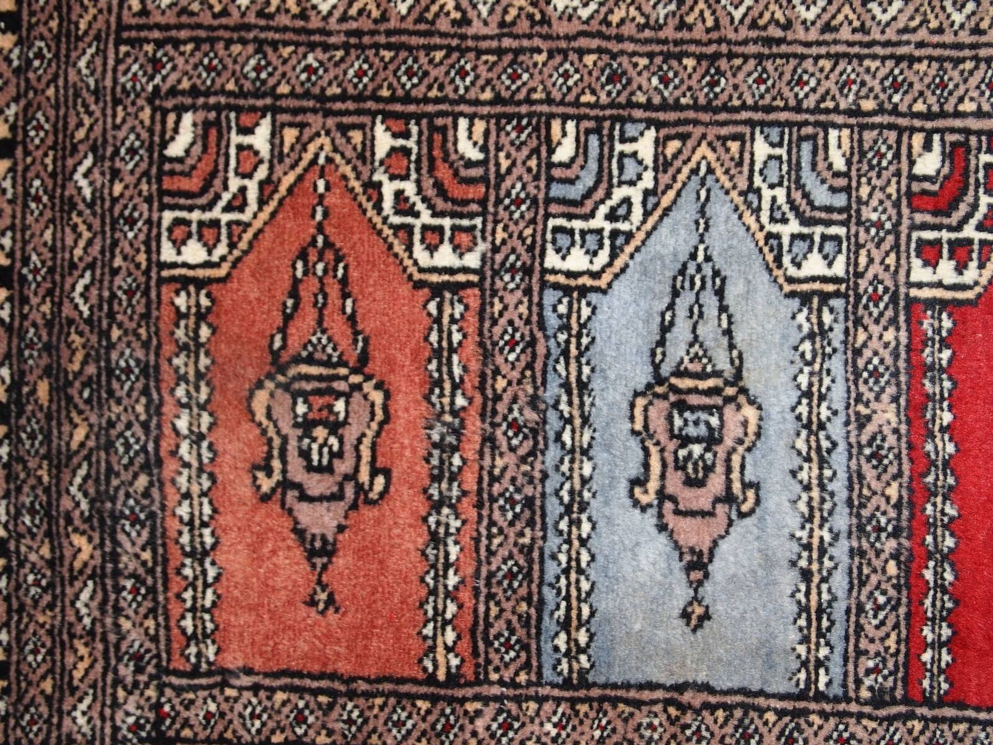 Tapis vintage fait main Bukhara de prière en laine rouge (45cm x 101cm)