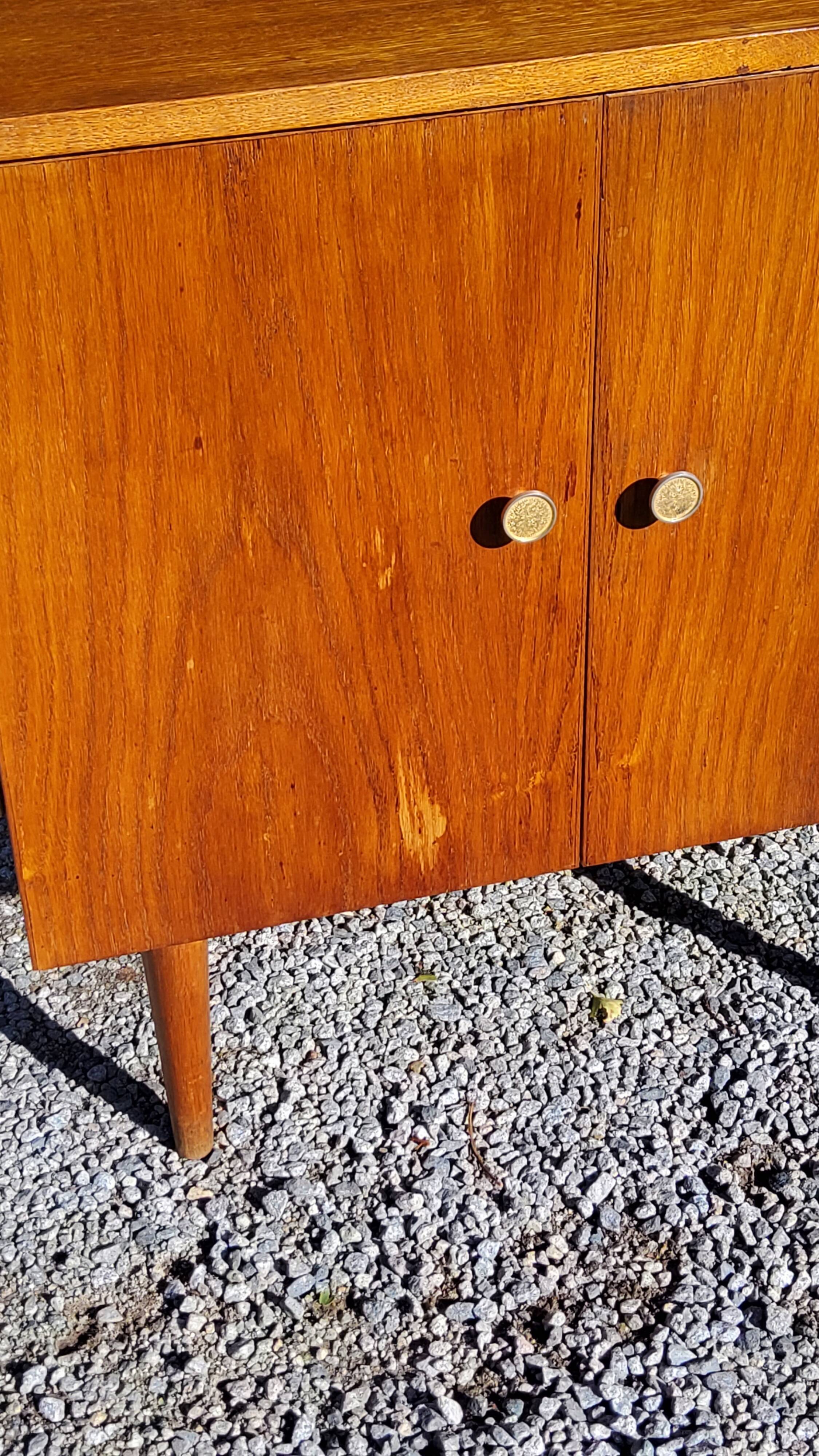 Vintage golden oak sideboard with conical legs from the 1950s
