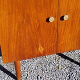 Vintage golden oak sideboard with conical legs from the 1950s