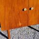 Vintage golden oak sideboard with conical legs from the 1950s