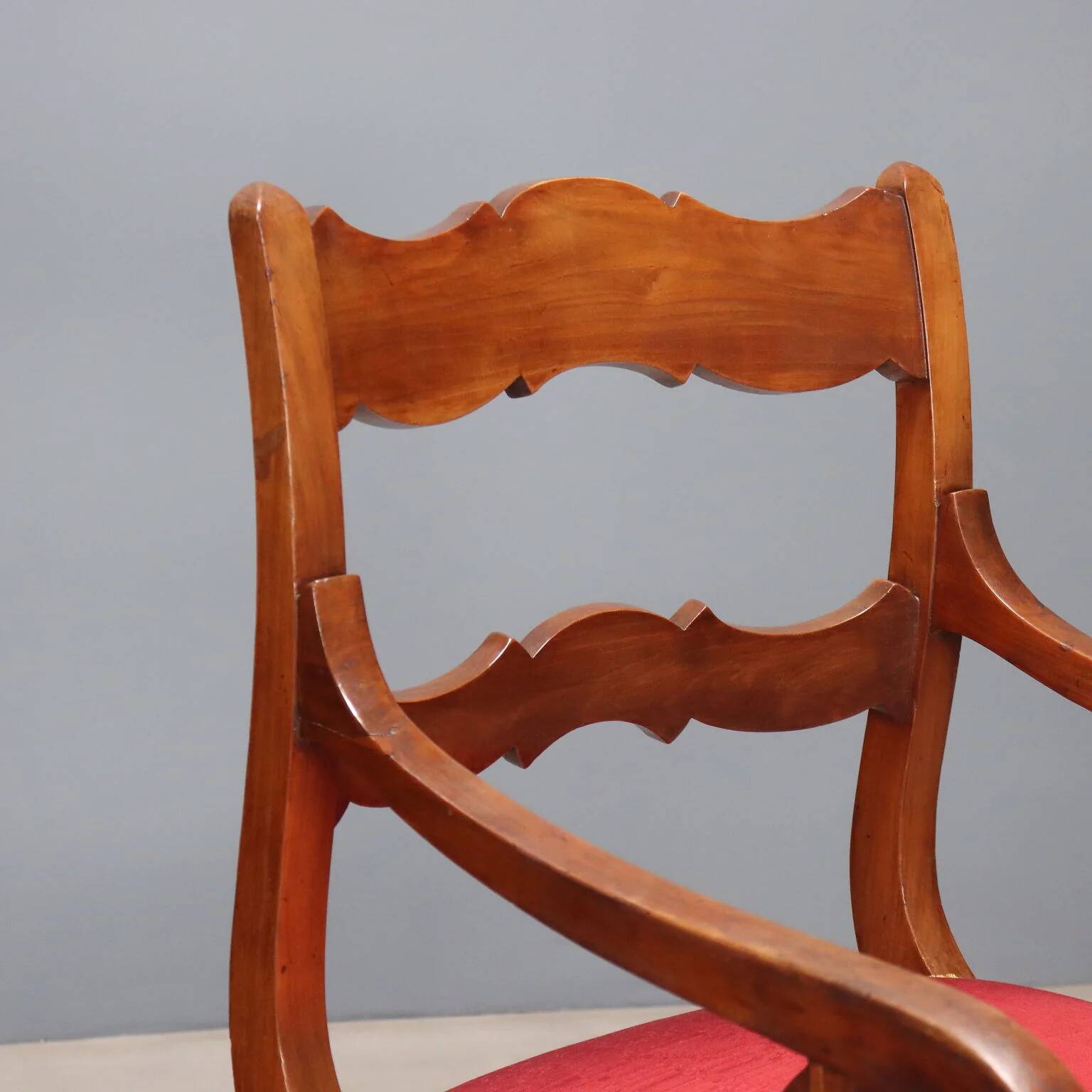 Antique Restoration-style armchair in walnut, fabric, Italy, 19th century.