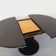 Vintage dining table in melamine with a black wood effect and chrome metal.