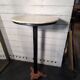 Bistro standing table with marble top and cast iron base.