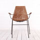Vintage wicker chair with armrests from the 1960s