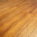 Round dining table with Scandinavian and Danish design in extendable teak from the 60s