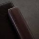 Pair of modern Danish lounge chairs in dark brown leather and rosewood, 1960s.