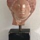 Woman's head in ceramic